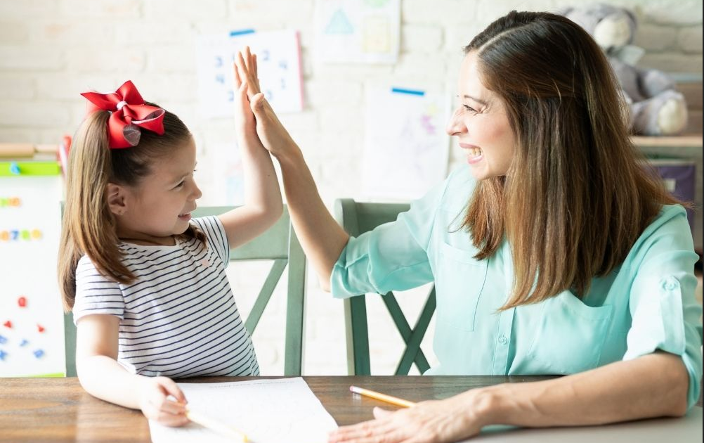 Parent supporting a child with homework at home